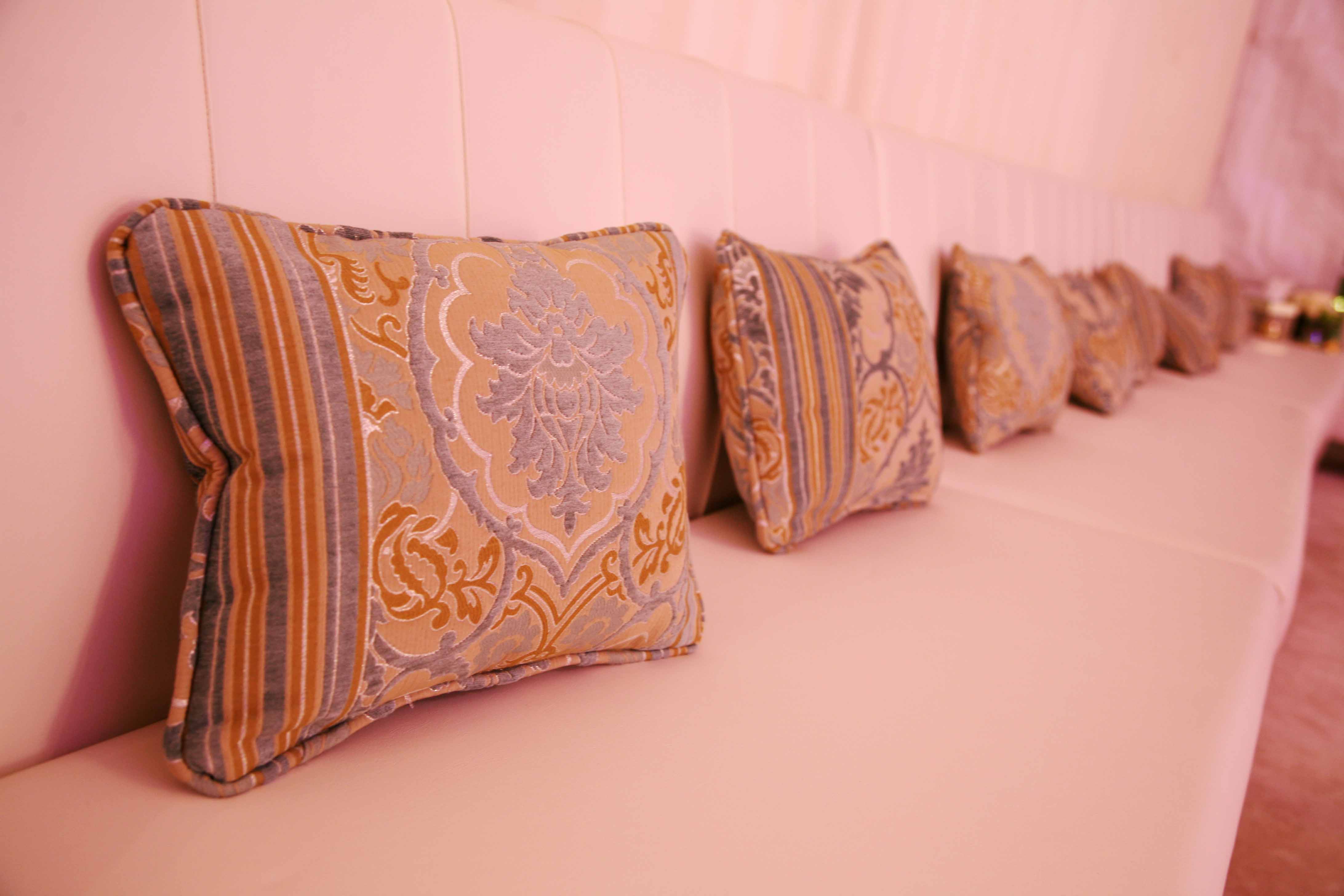 gold and teal pillows